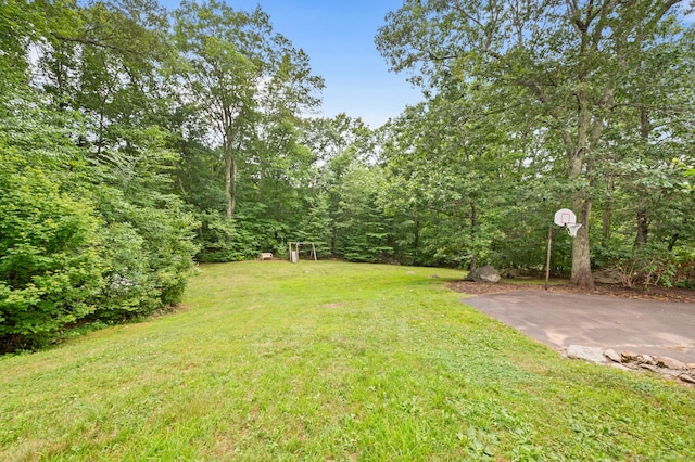 70 Shane Dr, Southbury, CT 06488 - view of grassy yard featuring basketball hoop and a view of trees