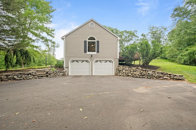 70 Shane Dr, Southbury, CT 06488 - view of side of property featuring driveway and an attached garage