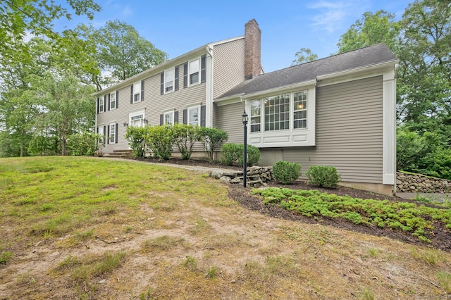 70 Shane Dr, Southbury, CT 06488 - view of front of property featuring a chimney and a front yard