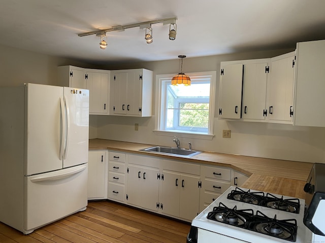 18 Depietro Dr, East Hartford, CT 06118 - kitchen featuring white appliances, light wood-style flooring, light countertops, white cabinets, and pendant lighting