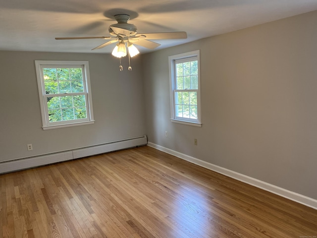 18 Depietro Dr, East Hartford, CT 06118 - empty room with a baseboard heating unit, ceiling fan, and wood finished floors