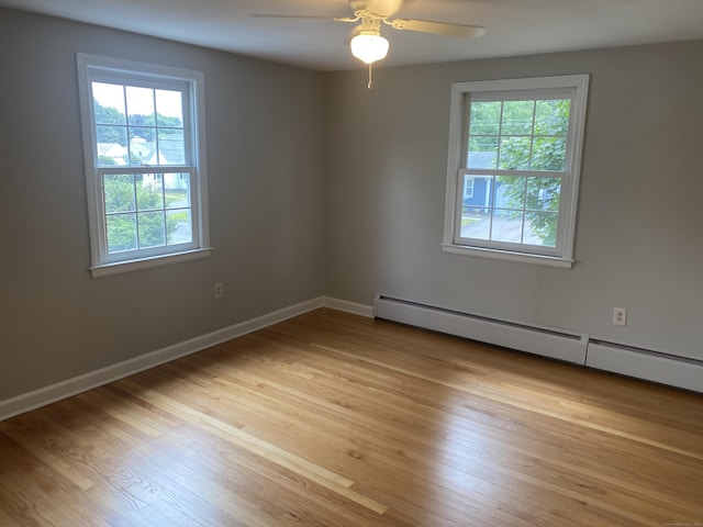 18 Depietro Dr, East Hartford, CT 06118 - spare room featuring a baseboard heating unit, a ceiling fan, and light wood-style flooring