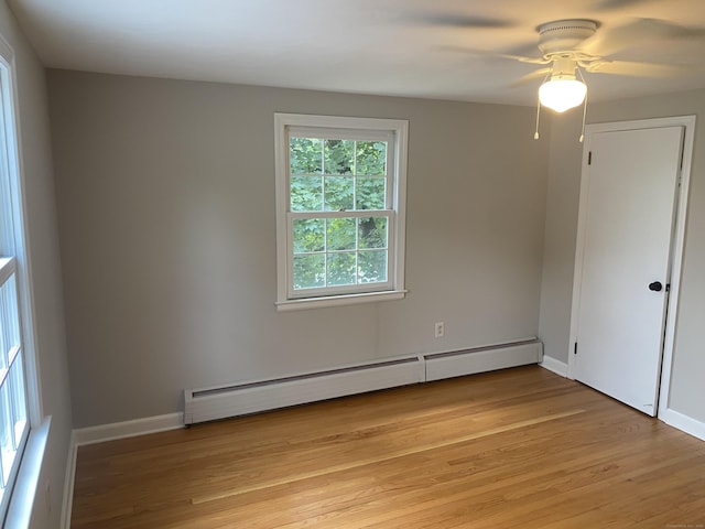 18 Depietro Dr, East Hartford, CT 06118 - empty room with baseboard heating, light wood finished floors, and ceiling fan