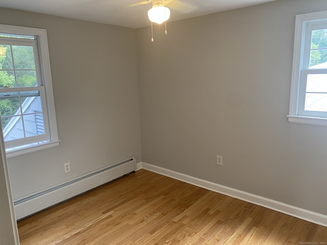 18 Depietro Dr, East Hartford, CT 06118 - unfurnished room with a baseboard radiator, plenty of natural light, light wood-style flooring, and a ceiling fan