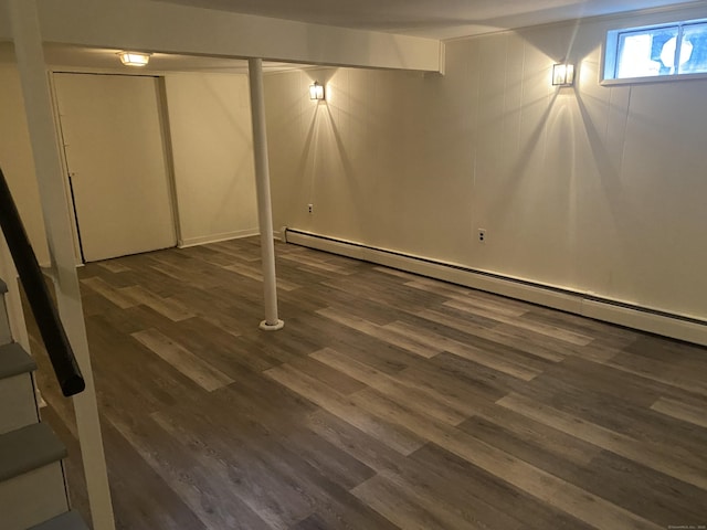 18 Depietro Dr, East Hartford, CT 06118 - below grade area with baseboard heating and dark wood-style flooring