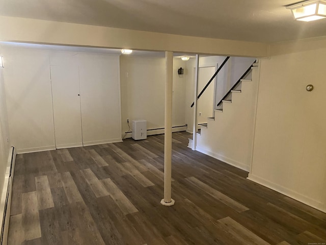 18 Depietro Dr, East Hartford, CT 06118 - finished below grade area featuring dark wood-style floors, stairs, and a baseboard heating unit