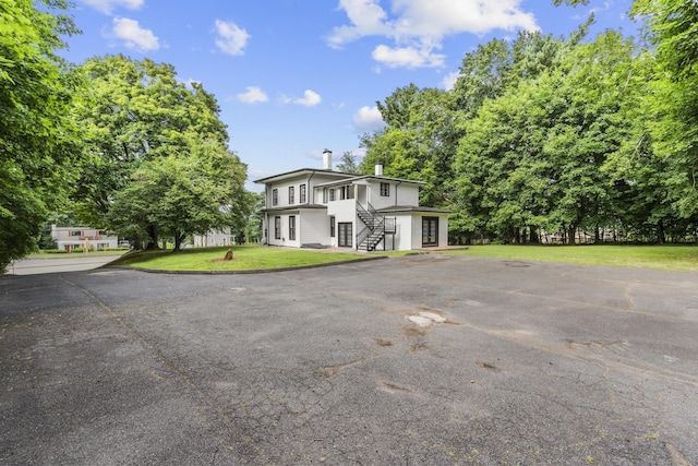 286 Marlborough St, Portland, CT 06480 - view of front of home with stairway, a front lawn, and a chimney