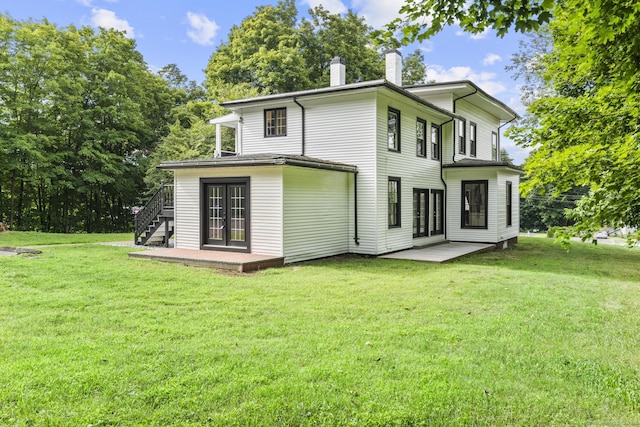 286 Marlborough St, Portland, CT 06480 - rear view of house featuring french doors, a lawn, and a chimney