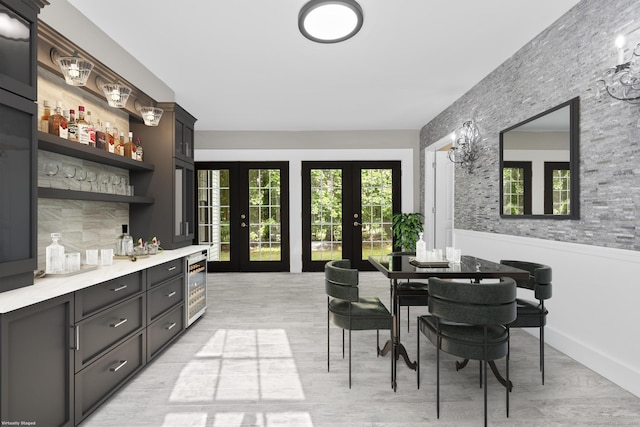 286 Marlborough St, Portland, CT 06480 - indoor dry bar with beverage cooler, light wood finished floors, and french doors