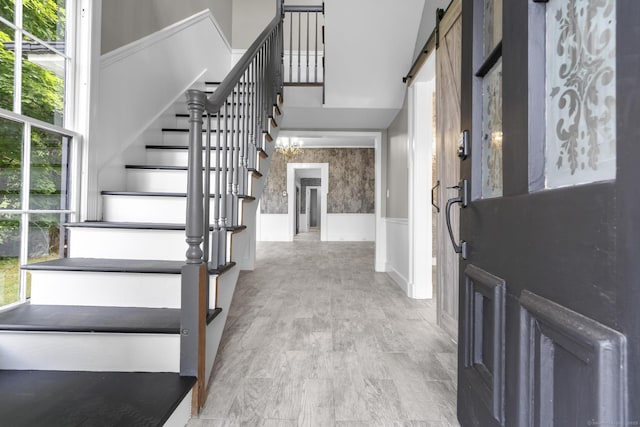 286 Marlborough St, Portland, CT 06480 - entryway with a wainscoted wall, stairs, and a high ceiling