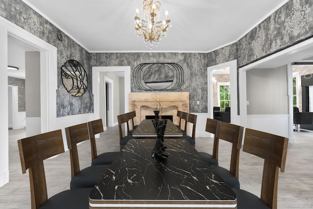 286 Marlborough St, Portland, CT 06480 - dining space featuring plenty of natural light, a chandelier, a wainscoted wall, a fireplace, and ornamental molding