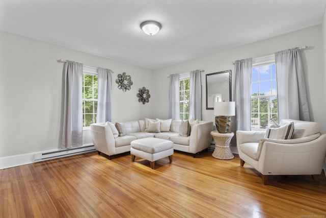 286 Marlborough St, Portland, CT 06480 - living room with a baseboard radiator, plenty of natural light, and wood finished floors