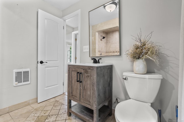 286 Marlborough St, Portland, CT 06480 - bathroom featuring heating unit, vanity, and stone tile floors