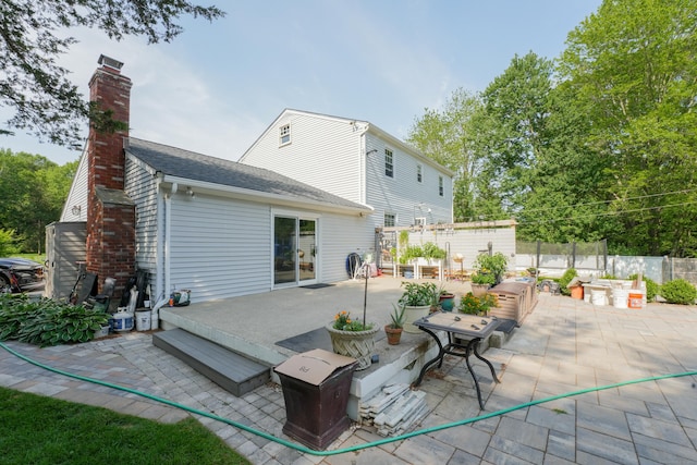 22 Standish Rd, New Milford, CT 06776 - rear view of property featuring a patio, a chimney, and roof with shingles