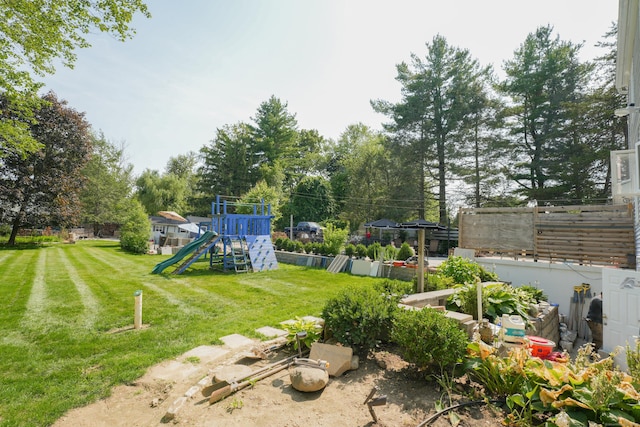 22 Standish Rd, New Milford, CT 06776 - view of green lawn featuring a playground and view of wooded area