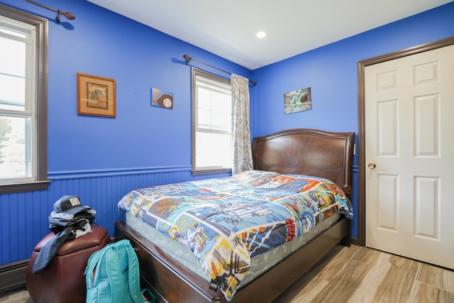 22 Standish Rd, New Milford, CT 06776 - bedroom with wainscoting, wood finished floors, and baseboard heating