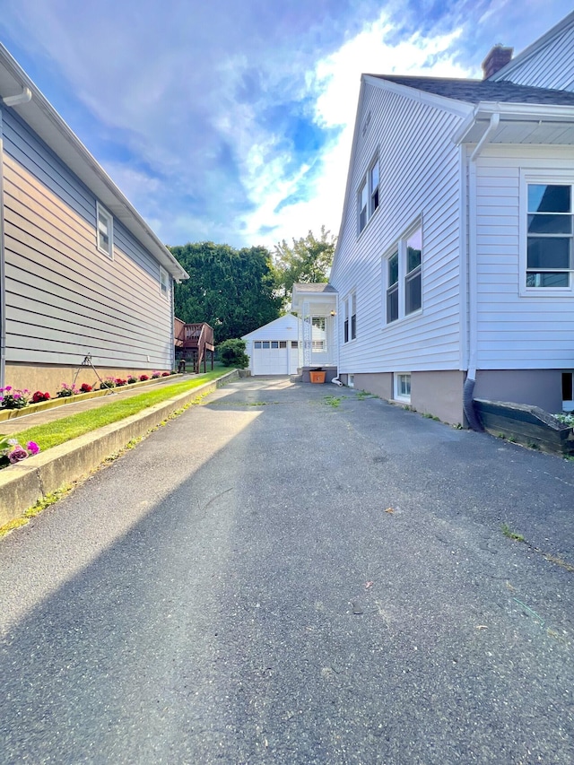 50 Norman St, Waterbury, CT 06708 - view of side of property featuring a garage and an outbuilding