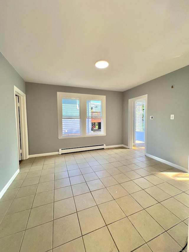 50 Norman St, Waterbury, CT 06708 - empty room featuring a baseboard radiator and light tile patterned floors