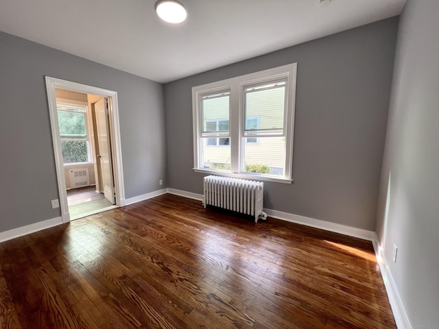 50 Norman St, Waterbury, CT 06708 - spare room with radiator and dark wood-type flooring