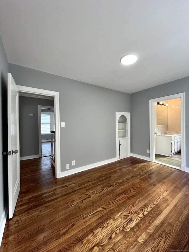 50 Norman St, Waterbury, CT 06708 - unfurnished room featuring dark wood-type flooring and baseboards