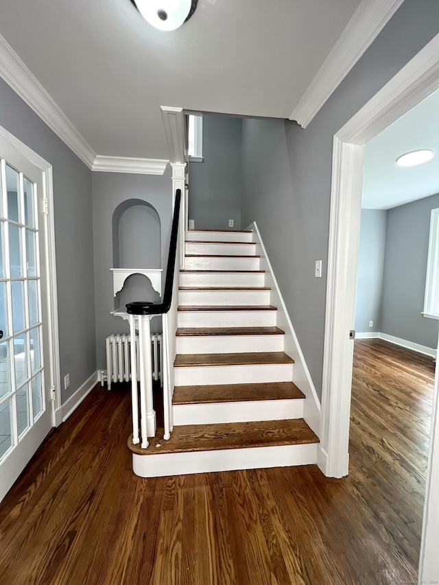 50 Norman St, Waterbury, CT 06708 - staircase featuring radiator, wood finished floors, and ornamental molding