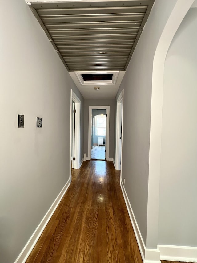 50 Norman St, Waterbury, CT 06708 - corridor with wood finished floors, arched walkways, and radiator heating unit