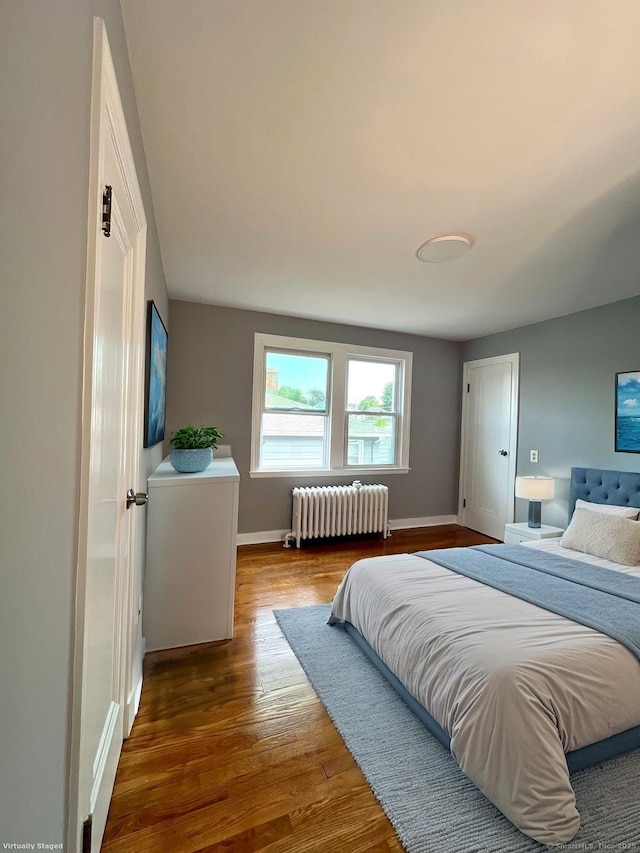 50 Norman St, Waterbury, CT 06708 - bedroom featuring radiator heating unit and wood finished floors