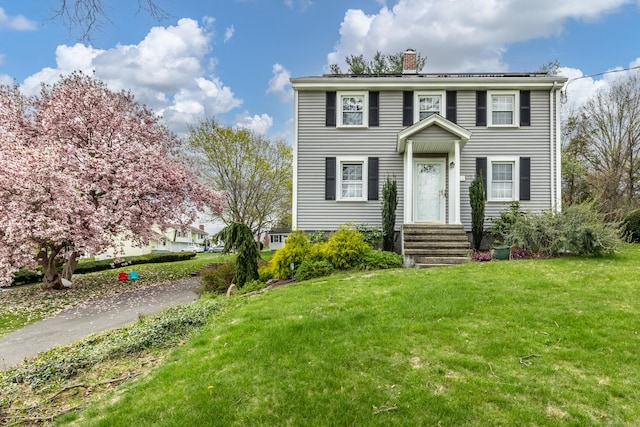 52 Lincoln St, Cromwell, CT 06416 - colonial inspired home with a chimney and a front yard
