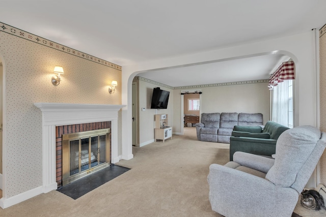 52 Lincoln St, Cromwell, CT 06416 - living area featuring arched walkways, carpet, and healthy amount of natural light