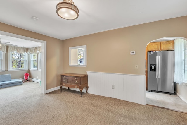 52 Lincoln St, Cromwell, CT 06416 - spare room with arched walkways, light colored carpet, a wainscoted wall, ceiling fan, and a smoke detector