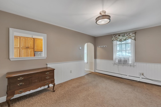 52 Lincoln St, Cromwell, CT 06416 - spare room featuring a wainscoted wall, cooling unit, arched walkways, carpet, and a baseboard heating unit