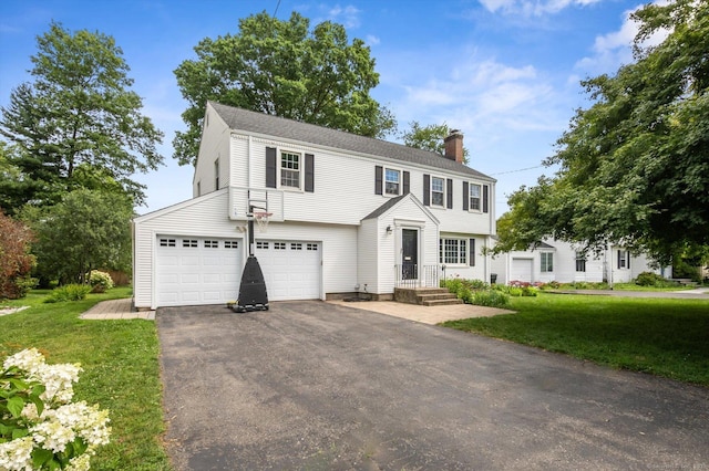 10 Craigmoor Rd, West Hartford, CT 06107 - colonial inspired home featuring a chimney, driveway, a front lawn, and an attached garage