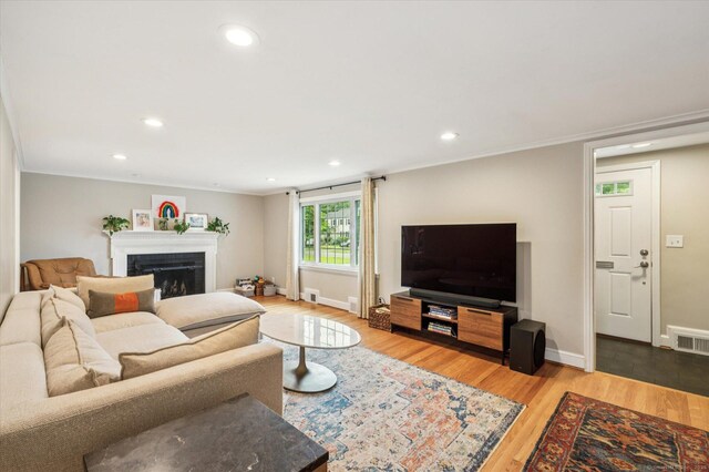 10 Craigmoor Rd, West Hartford, CT 06107 - living area with wood finished floors, a fireplace, recessed lighting, and ornamental molding