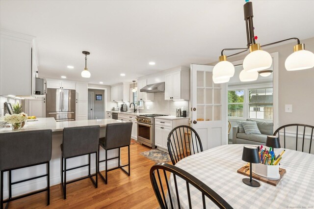 10 Craigmoor Rd, West Hartford, CT 06107 - dining area with light wood-style floors and recessed lighting