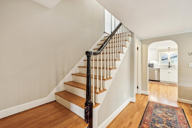 10 Craigmoor Rd, West Hartford, CT 06107 - staircase with wood finished floors and arched walkways