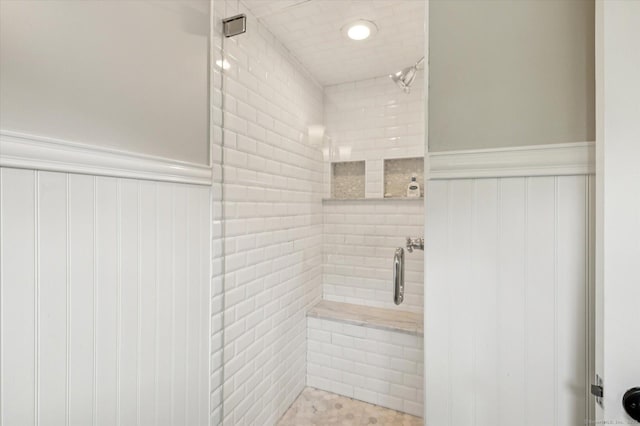 10 Craigmoor Rd, West Hartford, CT 06107 - bathroom featuring a shower stall, wainscoting, and a decorative wall
