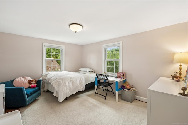 10 Craigmoor Rd, West Hartford, CT 06107 - bedroom featuring multiple windows and light colored carpet