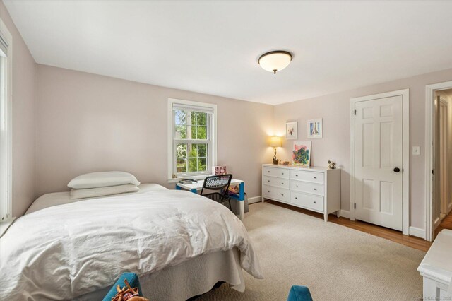 10 Craigmoor Rd, West Hartford, CT 06107 - bedroom with baseboards and wood finished floors