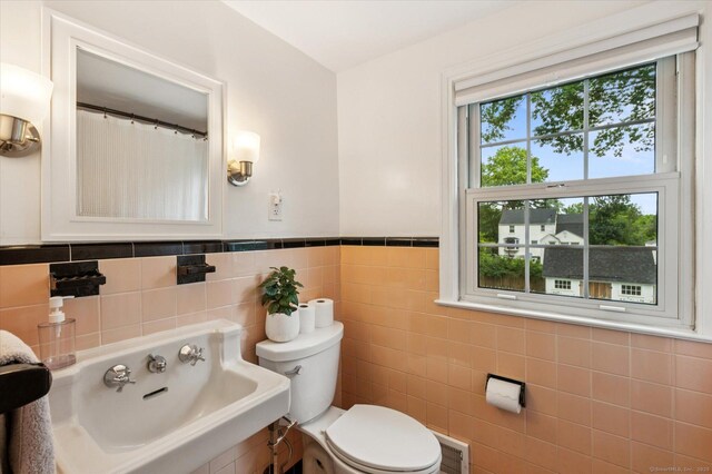 10 Craigmoor Rd, West Hartford, CT 06107 - bathroom with tile walls and a wainscoted wall