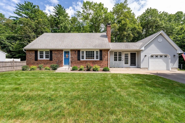 ranch-style house with a garage, a chimney, driveway, brick siding, and roof with shingles