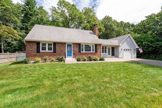 ranch-style home with a chimney, an attached garage, asphalt driveway, brick siding, and a shingled roof