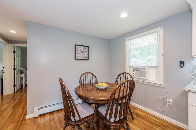 dining area with cooling unit, light wood finished floors, a baseboard heating unit, and recessed lighting