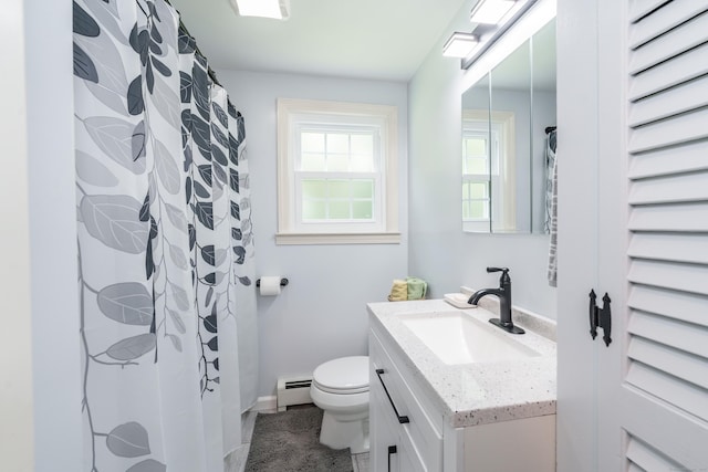 bathroom featuring a baseboard radiator, vanity, and tile patterned floors