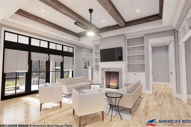 365 Cranberry Bog Rd, Killingly, CT 06239 - living room featuring beam ceiling, a lit fireplace, a ceiling fan, light wood-type flooring, and built in features