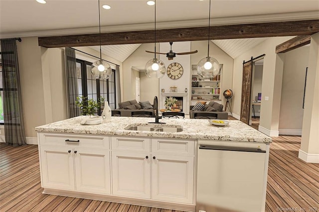 365 Cranberry Bog Rd, Killingly, CT 06239 - kitchen featuring dishwasher, open floor plan, light stone countertops, light wood-type flooring, and a barn door