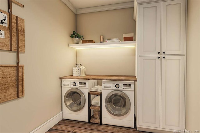 365 Cranberry Bog Rd, Killingly, CT 06239 - laundry room with washing machine and dryer, cabinet space, wood finished floors, and ornamental molding