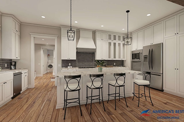 365 Cranberry Bog Rd, Killingly, CT 06239 - kitchen with stainless steel appliances, premium range hood, decorative backsplash, light wood-type flooring, and a kitchen bar