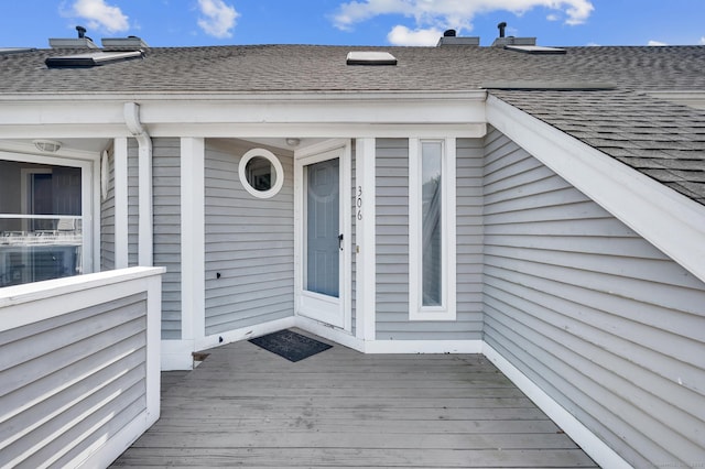 233 Mansfield Grove Rd Unit 306, East Haven, CT 06512 - doorway to property featuring a shingled roof and a wooden deck