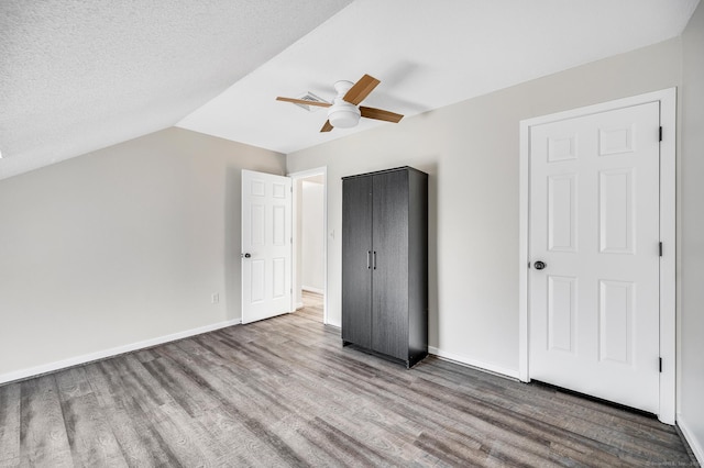 233 Mansfield Grove Rd Unit 306, East Haven, CT 06512 - unfurnished bedroom with wood finished floors, a ceiling fan, lofted ceiling, and a textured ceiling