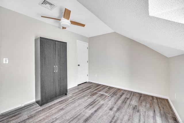 233 Mansfield Grove Rd Unit 306, East Haven, CT 06512 - bonus room with wood finished floors, ceiling fan, lofted ceiling, and a textured ceiling